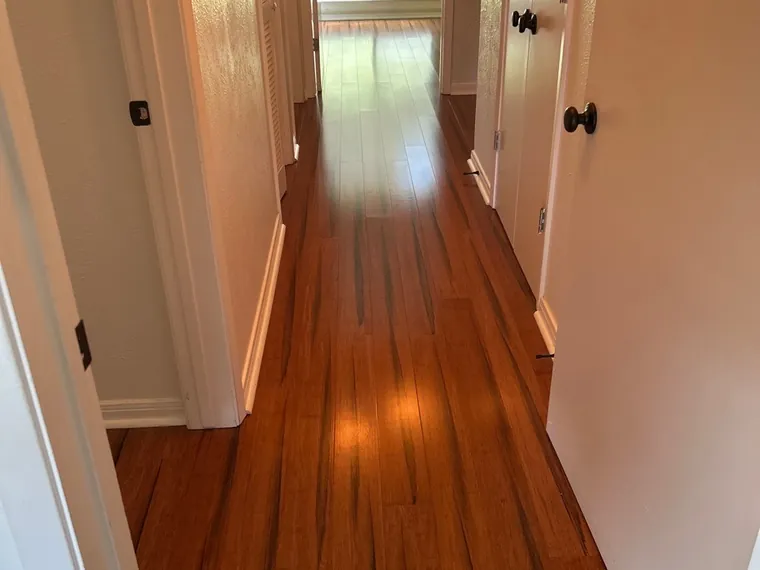 Gleaming wood floors and hallway after a house clean